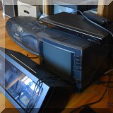 E05. Electric watch winder, TV, Sony DVD player.